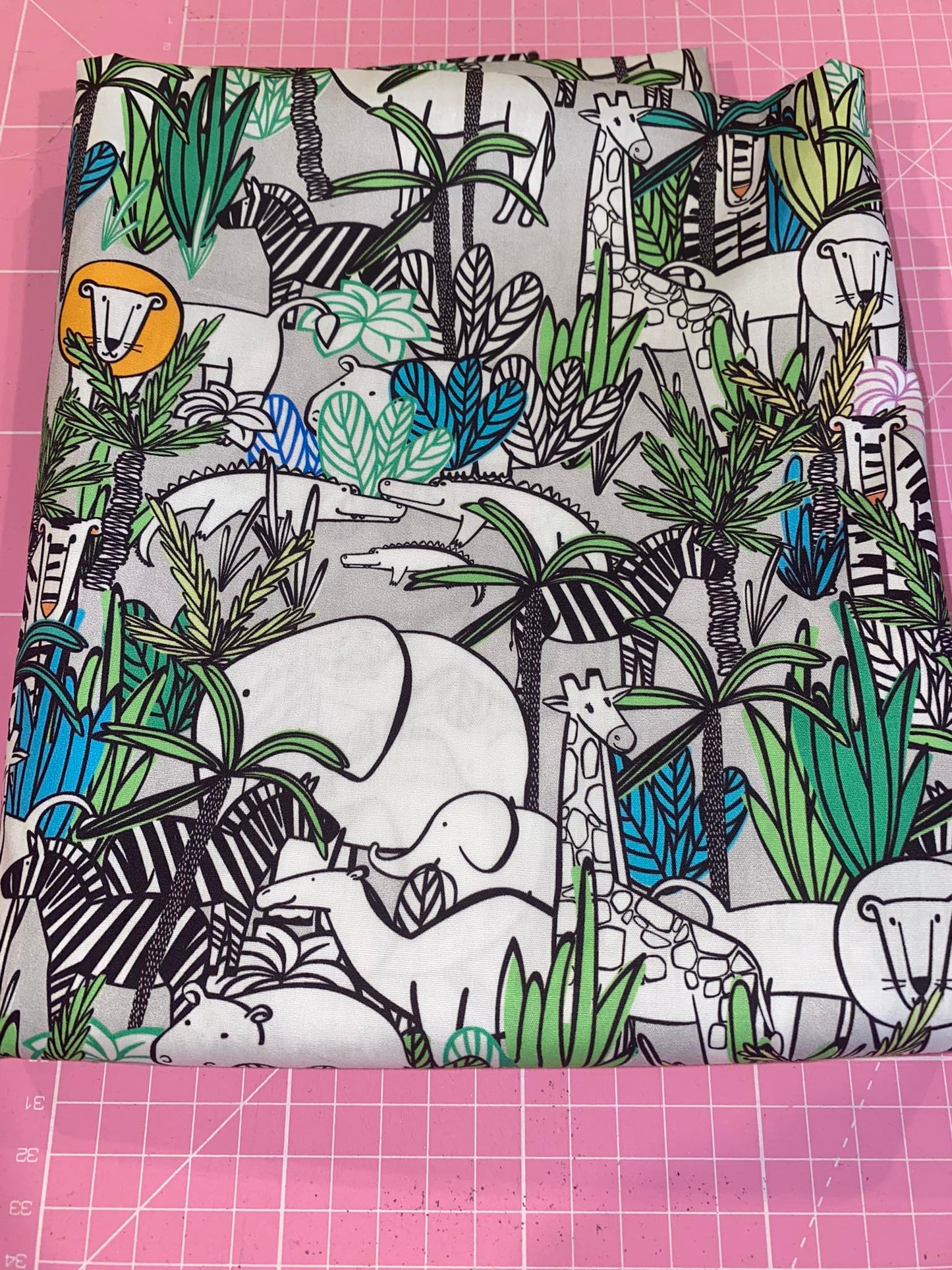 Jungle theme on white woven cotton